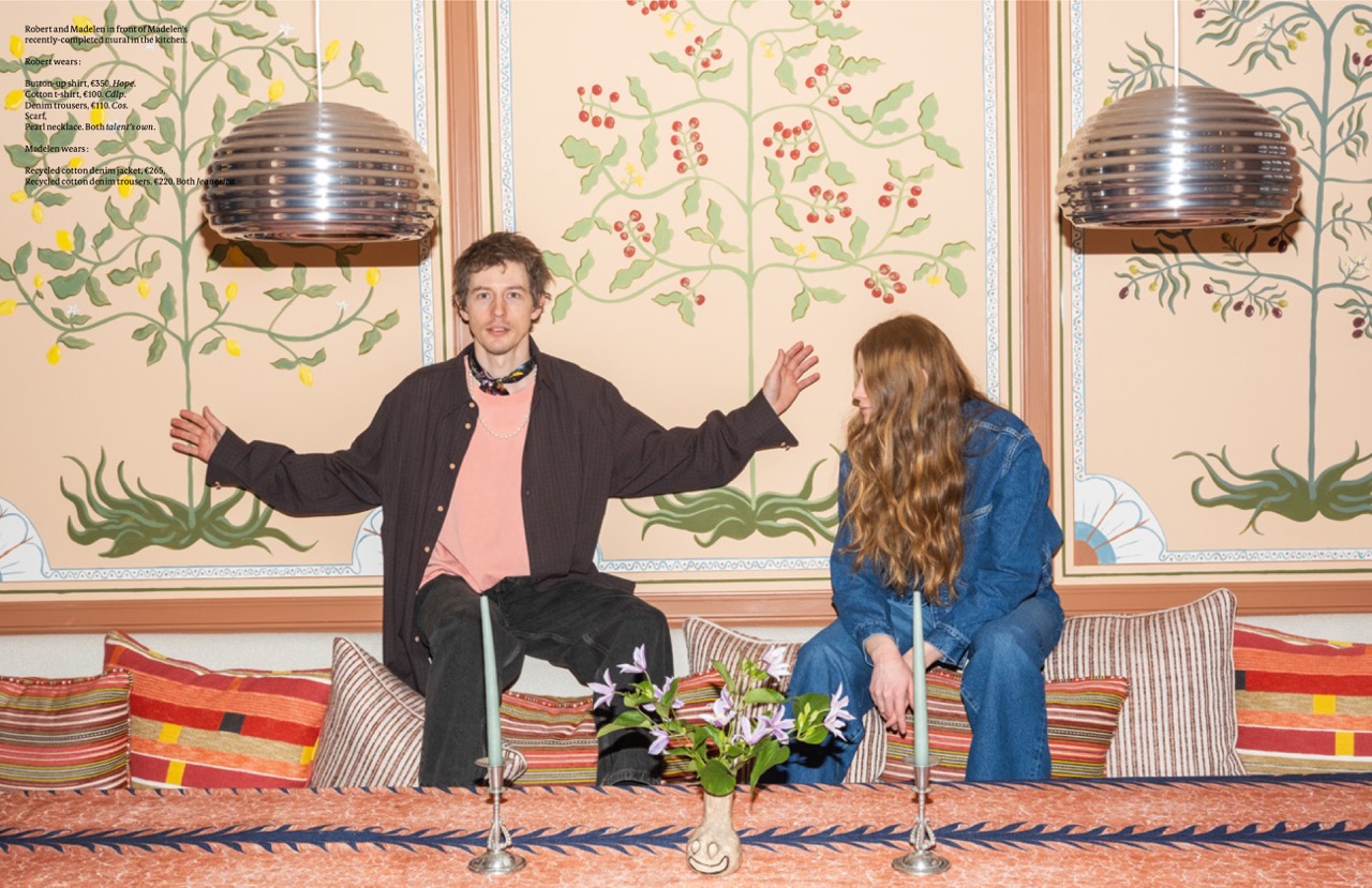 Madelen and Robert Möllard siblings in front of bespoke botanical mural