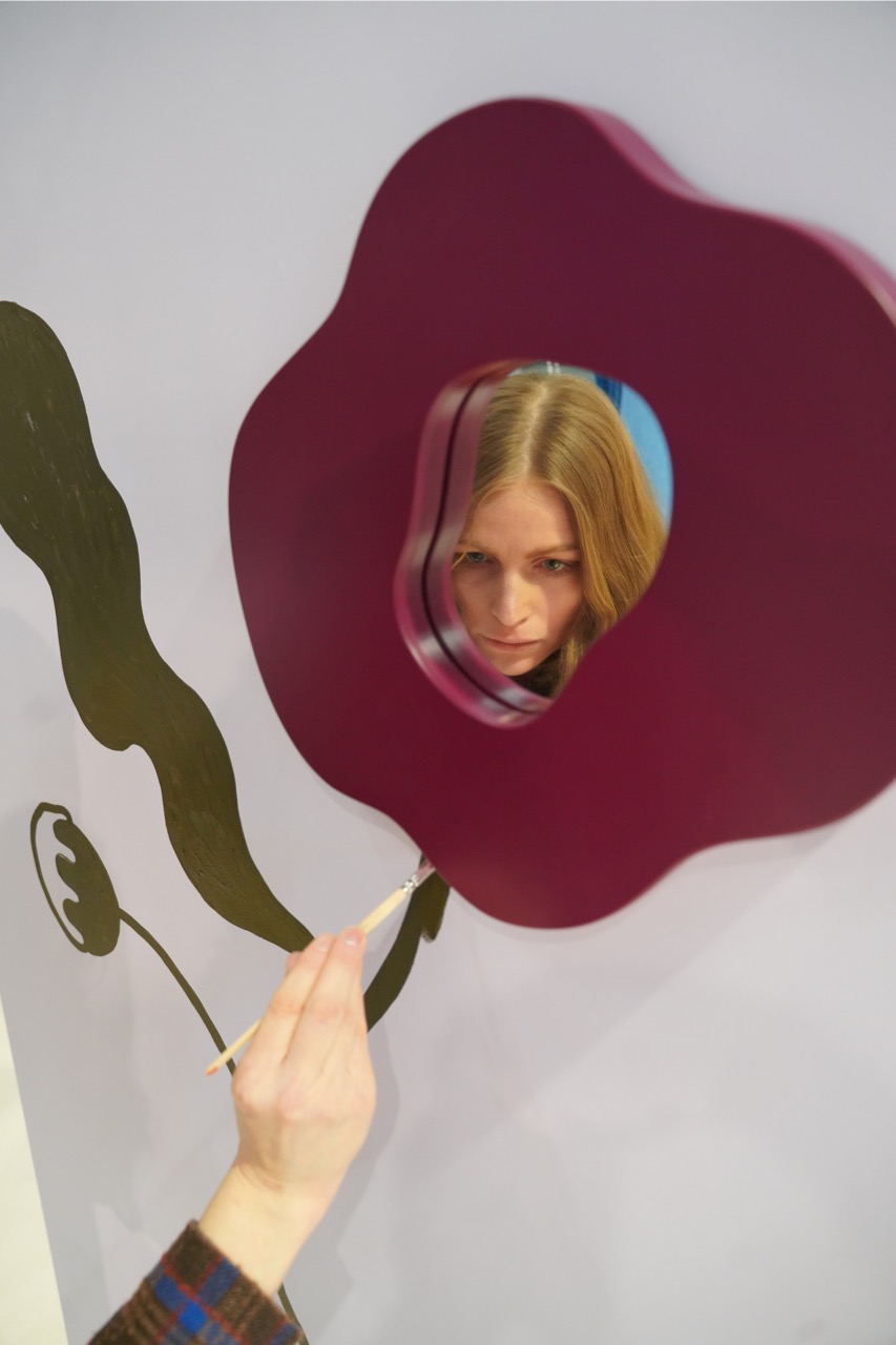 Artist Madelen Möllard painting bespoke mural at Stockholm Furniture Fair. Poppy mirror